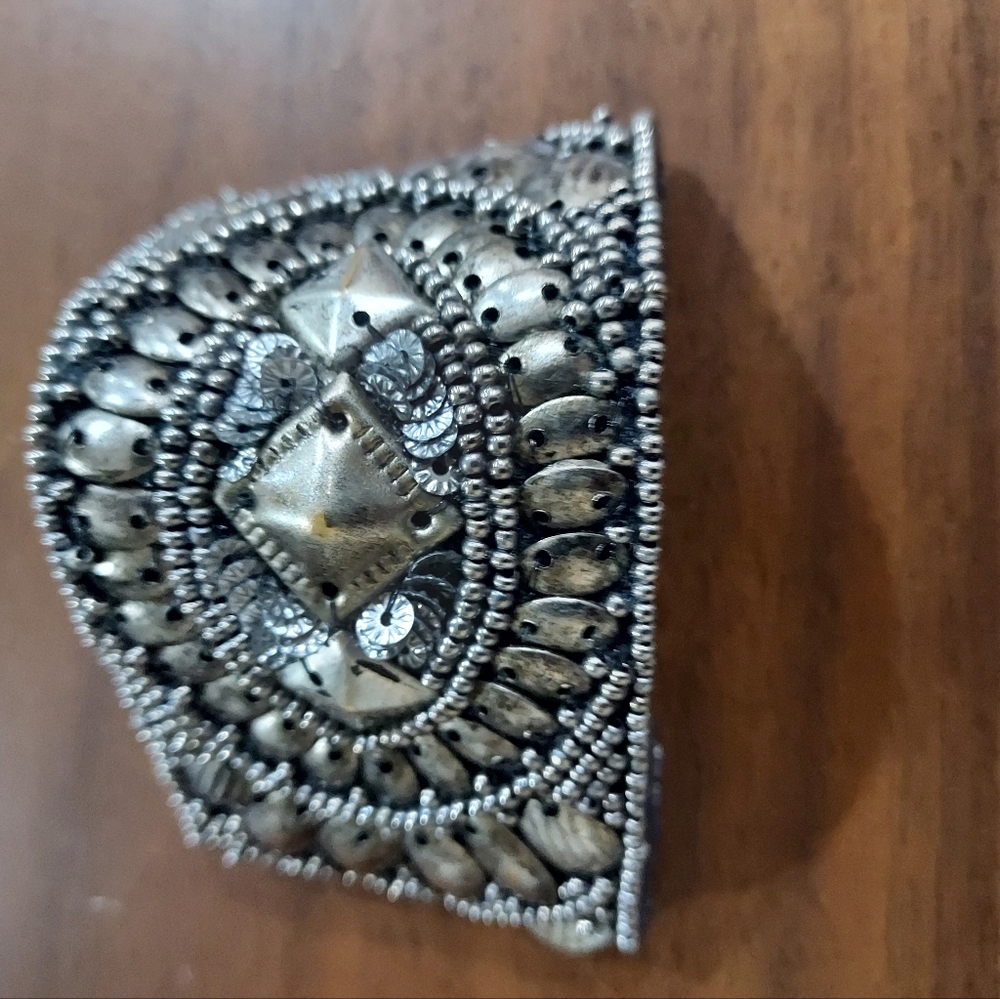 Boho silver cuff bracelet on black fabric back